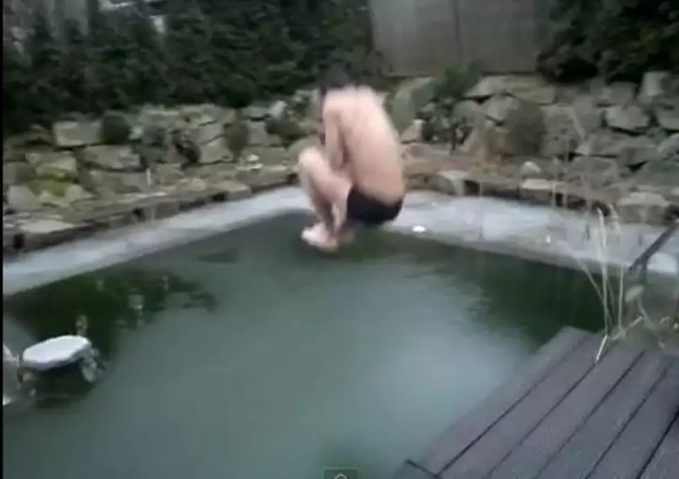 Man Jumps Into Frozen Pool [VIDEO]
